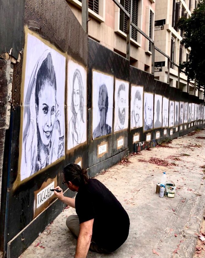 Beirut blast memorial wall covered in portraits of victims