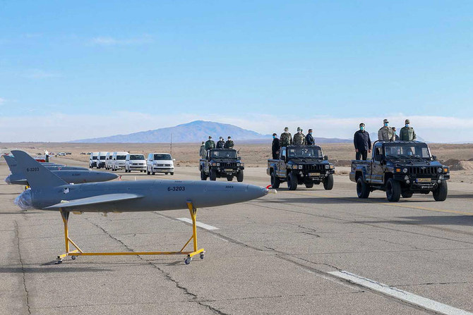 A handout photo made available by the Iranian Army office on January 5, 2021, shows military officials inspecting drones on display prior to a military drone drill at an undisclosed location in central Iran. (AFP/Iranian Army Office/File Photo)