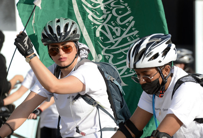 Saudi women take part in a cycling race to mark World Obesity Day celebration in Riyadh's Princess Nourah University. (AFP/File Photo)