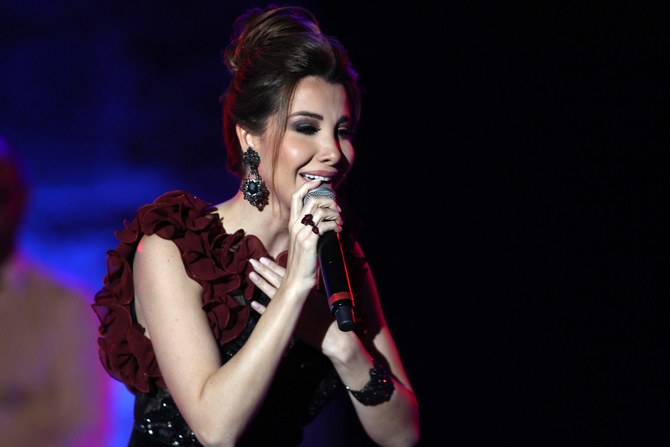 Lebanese superstars Nancy Ajram (pictured) and Ragheb Alama will co-headline the second Infinite Nights show on Nov. 12. (AFP)