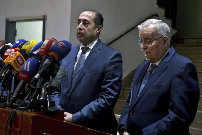 Arab League Assistant Secretary General Hossam Zaki, left, speaks during a joint news conference with Lebanese Foreign Minister Abdallah Bouhabib, in Beirut on Monday. (AP)
