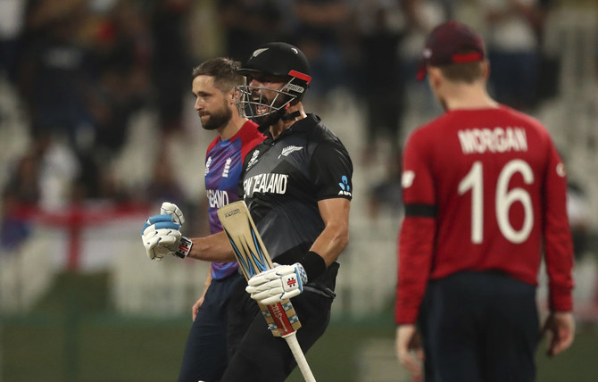 New Zealand's batsman Daryl Mitchell celebrates after winning the Cricket Twenty20 World Cup semi-final match against England in Abu Dhabi. (AP)