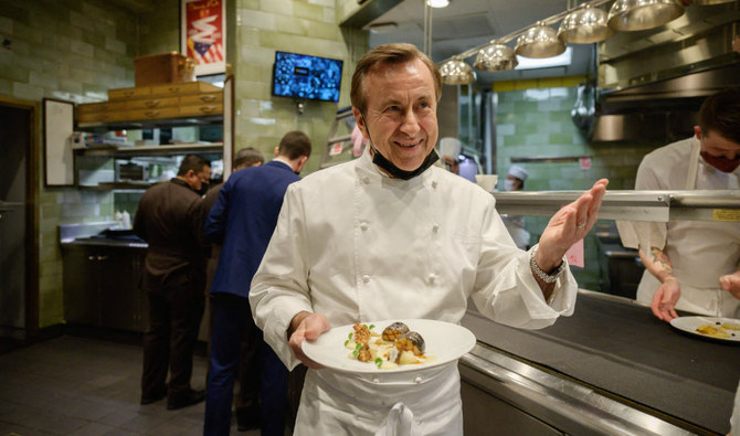 French chef and restaurateur Daniel Boulud works in the kitchen of his restaurant 'Daniel', in Manhattan, New York city on November 19, 2021. (AFP)