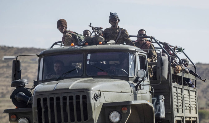 In this Saturday, May 8, 2021 file photo, Ethiopian government soldiers ride in the back of a truck on a road near Agula, north of Mekele, in the Tigray region of northern Ethiopia. (AP)