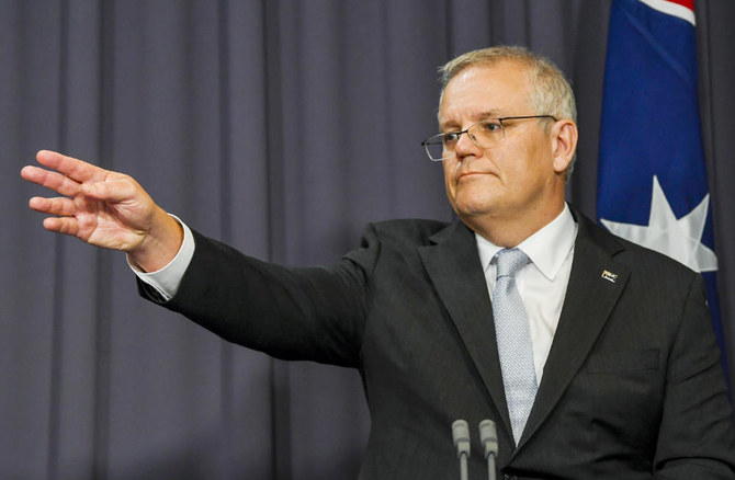 Australian Prime Minister Scott Morrison gestures during a press conference at Parliament House in Canberra, Thursday, Nov. 25, 2021. (AP)