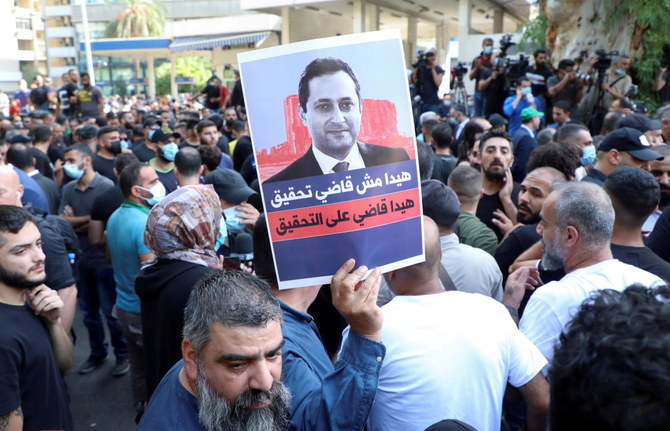 Supporters of Lebanese Shiite groups Hezbollah and Amal and the Christian Marada movement take part in a protest against Tarek Bitar, the lead judge of the port blast investigation, in Beirut in October. (Reuters)
