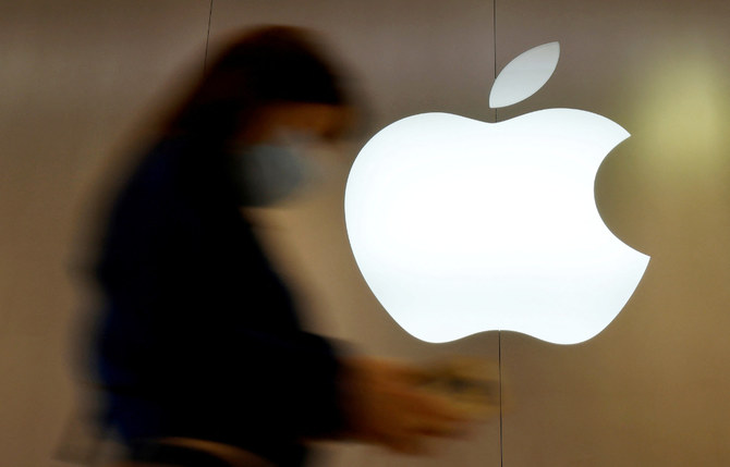 A woman walks past an Apple logo in front of an Apple store in Saint-Herblain near Nantes, France, September 16, 2021. (REUTERS)