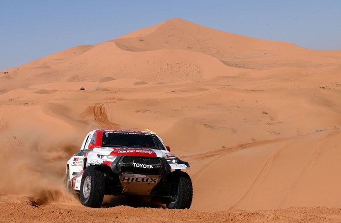 Toyota's South African driver Henk Lategan and co-driver Brett Cummings of South Africa compete during the Stage 5 of the Dakar 2022 around Riyadh in Saudi Arabia, on Jan. 6. (AFP)