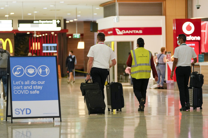 A flight crew walk through the terminal at Sydney Airport, Monday, Nov. 29, 2021. (AP)