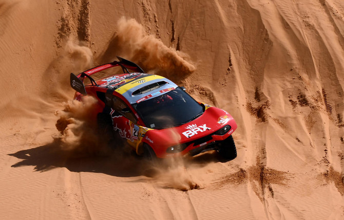 French driver Sebastien Loeb and co-driver Fabian Lurquin of Belgium compete during an earlier stage of the Dakar Rally. (AFP)