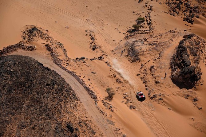 Toyota's driver Giniel De Villiers and his co-driver Dennis Murphy compete during the Stage 9 of the Dakar 2022 around Wadi Ad Dawasir in Saudi Arabia, on January 11, 2022. (AFP)