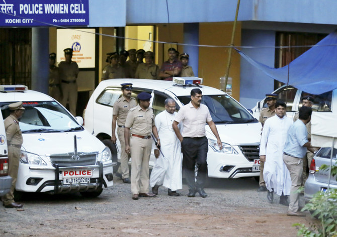 Bishop of the Indian city of Jalandhar, Franco Mulakkal, center, leaves after being questioned by police in Kochi, India, Sept. 19, 2018.  (AP)