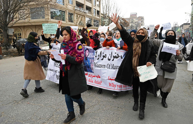 Afghan women march as they chant slogans and hold banners during a women's rights protest in Kabul on January 16, 2022. (AFP)