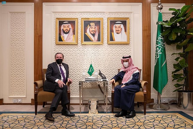 Saudi Foreign Minister Prince Faisal bin Farhan meets former German Chancellor Gerhard Schroeder. (SPA)