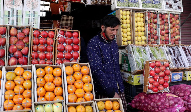 In this photo taken on Jan. 13, 2022 a fruit vendor waits for customers at his store in Shopian district, Indian-administered Kashmir. There are fears of crisis with the arrival of Iranian apples. (AN photo)