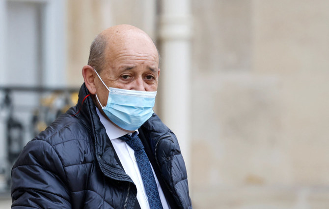 France's European and Foreign Affairs Minister Jean-Yves Le Drian leaves the weekly cabinet meeting at The Elysee Presidential Palace in Paris on January 26, 2022. (AFP)