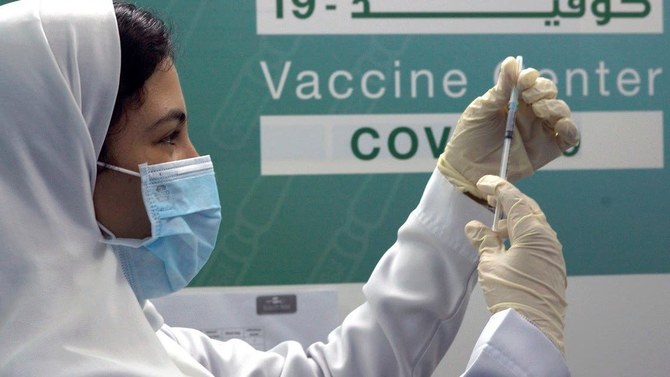 Saudi physician Hala Alkattan prepares to inject a Pfizer vaccine at a new coronavirus vaccination center in Jeddah. (AP/File Photo)