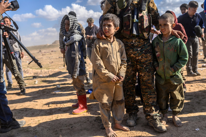 Children believed to be from the Yazidi community, who were captured by Daesh fighters, are pictured after being evacuated from the embattled Daesh holdout of Baghouz. (AFP/File Photo)