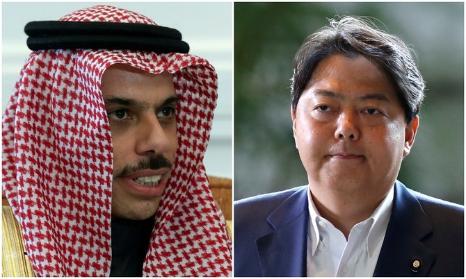 Japan’s foreign minister Hayashi Yoshimasa (R) help a phone call with Prince Faisal bin Farhan, Minister for Foreign Affairs of Saudi Arabia. (Reuters/File Photos)