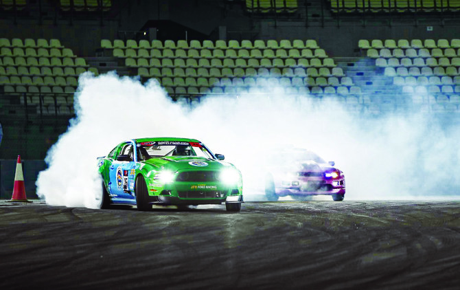 Abdulhadi Alqahtani, a professional Saudi drifter, seen drifting in a tuned Ford Mustang with his own  Al-Jazirah Racing Team. (Supplied)