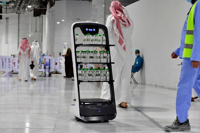 The Zamzam water dispensing robot can distribute 30 bottles in one round. (SPA)