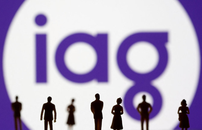 Small toy figures are seen in front of displayed IAG (Insurance Australia Group) logo in this illustration taken on Nov. 8, 2021. (REUTERS/File Photo)