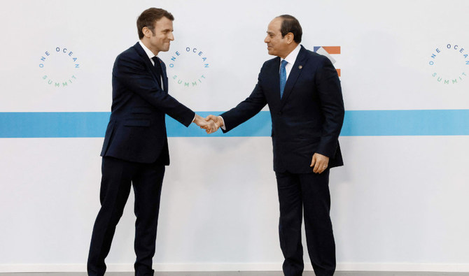 France's President Emmanuel Macron (L) welcomes Egypt' President Abdel Fatah al-Sissi (R) before the Hight Level Segment session of the One Ocean Summit in the northwestern France port city of Brest on Feb. 11, 2022. (AFP)