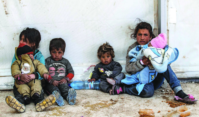Children sit on the ground at the Kurdish-run Al-Hol camp. (AFP/File)
