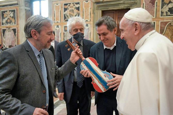 Pope blesses violin made from Mediterranean migrant boat