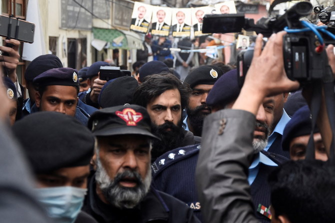 Police officers escort Zahir Jaffer, a US national of Pakistani origin, after court announced a death sentance to him for raping and beheading Noor Mukadam, 27, the daughter of a former diplomat, at district court in Islamabad, on Thursday. (Reuters)