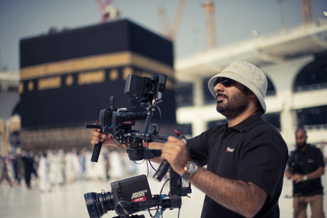 Filmmaker Abrar Hussain films in the Mataf area of the Grand Mosque in Makkah, Saudi Arabia, in October 2017. (Photo courtesy: Red Face Films)