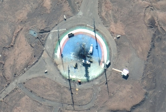 In this satellite photo from Maxar Technologies, trucks and other equipment surround a scorched launch pad at Iran's Imam Khomeini Spaceport in rural Semnan province Sunday, Feb. 27, 2022. (AP)