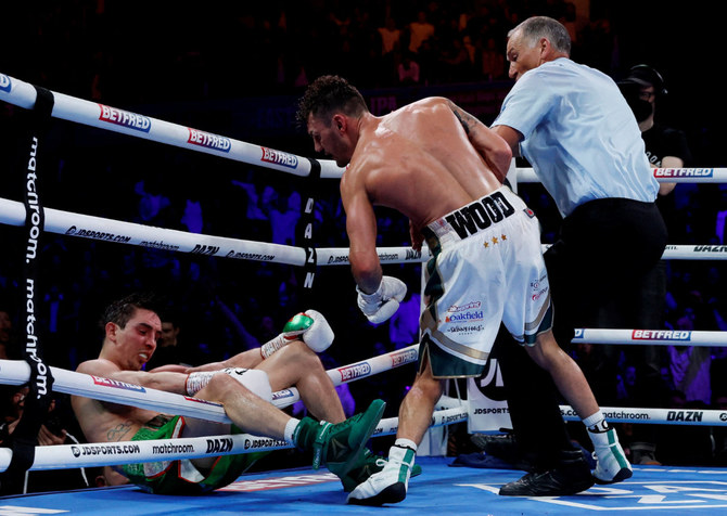 Boxer Michael Conlan OK after being knocked out of ring