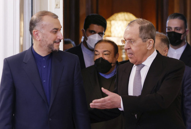 Russian Foreign Minister Sergey Lavrov, right, welcomes Iranian Foreign Minister Hossein Amir Abdollahian for the talks in Moscow, Russia, Tuesday, March 15, 2022. (AP)
