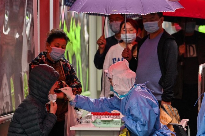 Shanghai pushes ahead with mass COVID-19 tests as new cases spike