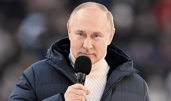 Russian President Vladimir Putin delivers a speech during a concert marking the eighth anniversary of Russia's annexation of Crimea at Luzhniki Stadium in Moscow. (Reuters)