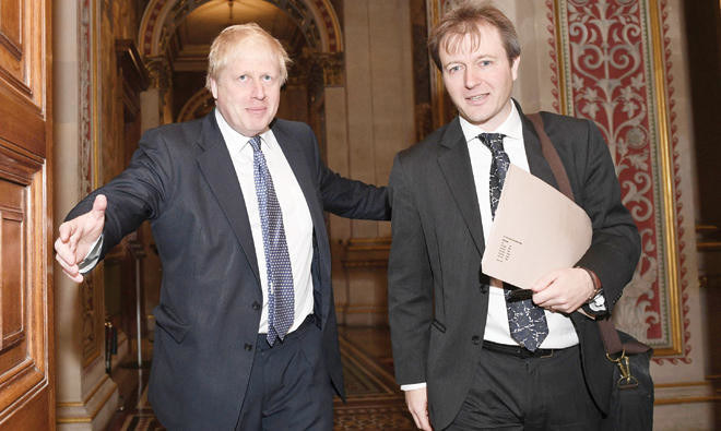 Britain’s then-Foreign Secretary Boris Johnson with Richard Ratcliffe, the husband of British-Iranian woman Nazanin Zaghari-Ratcliffe, at the Foreign and Commonwealth Office in London. (AFP/File Photo)