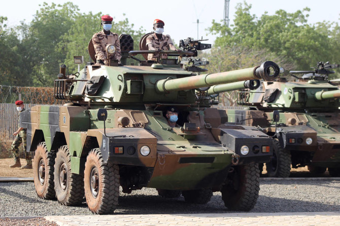 Soldiers ride an armored vehicle in N’Djamena on Jan. 23, 2021, given by France to help Chad fight terror. (AFP)