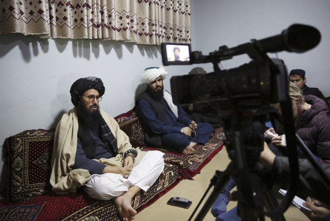 In this Saturday, Dec. 14, 2019, photo, Maulvi Niaz Mohammad, 45, left, speaks during an interview with The Associated Press inside the Pul-e-Charkhi jail in Kabul, Afghanistan. (AP)