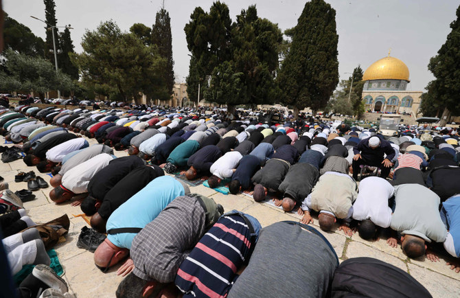 Palestinian Muslim worshippers attend Ramadan Fridays prayers near the Dome of the Rock mosque in the al-Aqsa mosque compound in the Old City of Jerusalem on April 8, 2022. (AFP)