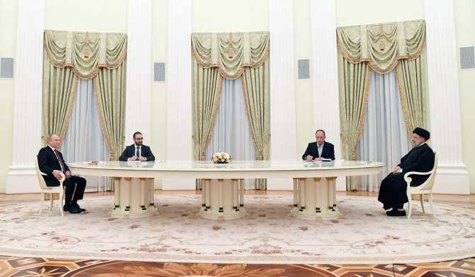 Russian President Vladimir Putin, left, and Iranian President Ebrahim Raisi, right, meet in the Kremlin in Moscow, Russia, Jan. 19, 2022. (AP)