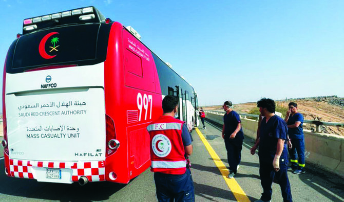Paramedics from the Saudi Red Crescent are on the Al-Hijra Road in Friday morning, moments before the injured were taken to several hospitals in al-Madinah al-Munawwarah. (Supplied/ SRCA)