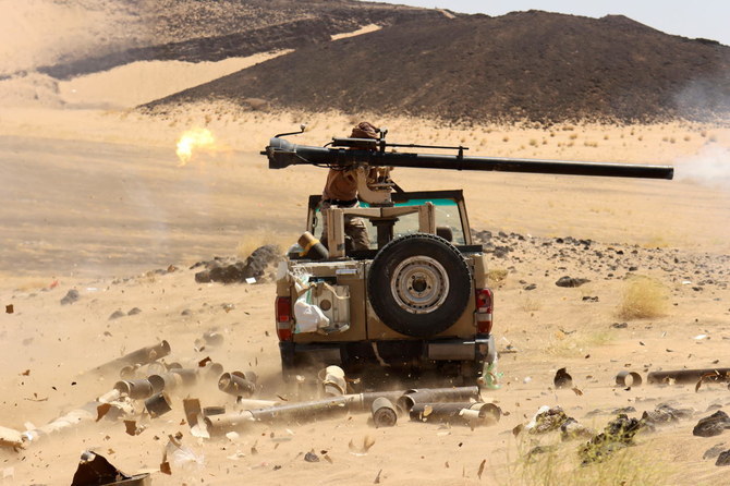 A Yemeni government fighter fires a vehicle-mounted weapon at Houthi positions, Marib, Yemen, Mar. 9, 2021. (Reuters/File Photo)