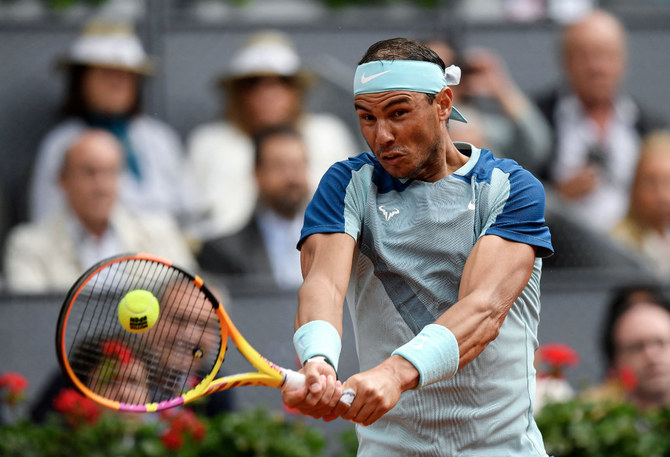 Nadal returns from injury with straight-set win in Madrid