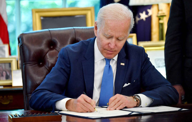 US President Joe Biden signs into law the Ukraine Democracy Defense Lend-Lease Act of 2022 on May 9, 2022. (AFP)