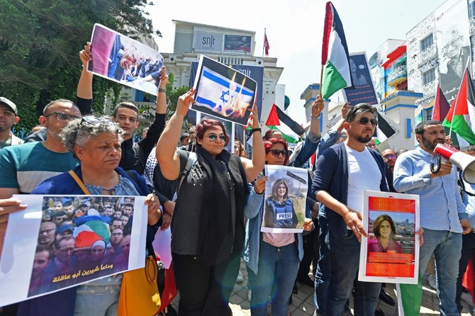 Tunisian journalists protest the death of veteran Al-Jazeera Palestinian journalist Shireen Abu Akleh. (AFP)