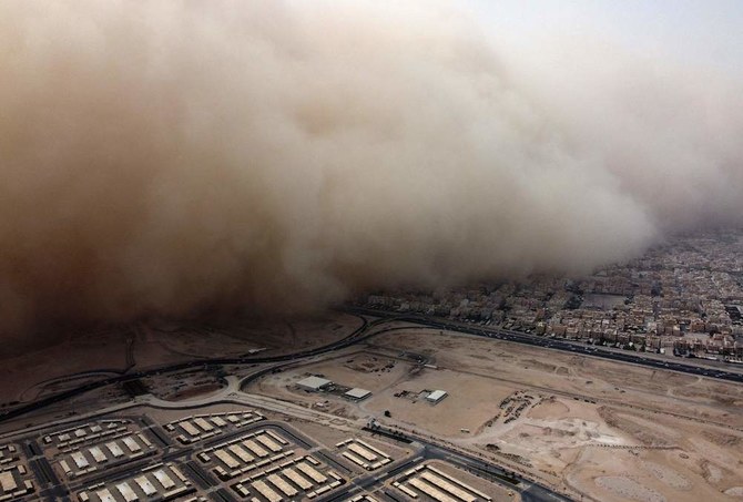 This picture taken on May 23, 2022 shows an aerial view of a massive dust storm advancing into Kuwait City above Kuwait Universi