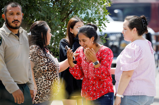A woman reacts outside the Ssgt Willie de Leon Civic Center in Uvalde, Texas, U.S. May 24, 2022. (REUTERS)