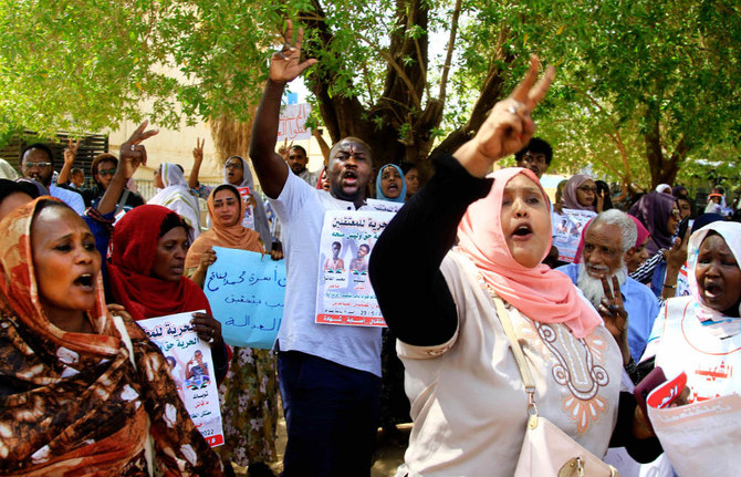  Sudanese protesters rally outside a court in Khartoum on Sunday to support fellow demonstrators. (AFP)