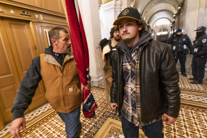 Man who carried Confederate flag into Capitol heads to trial